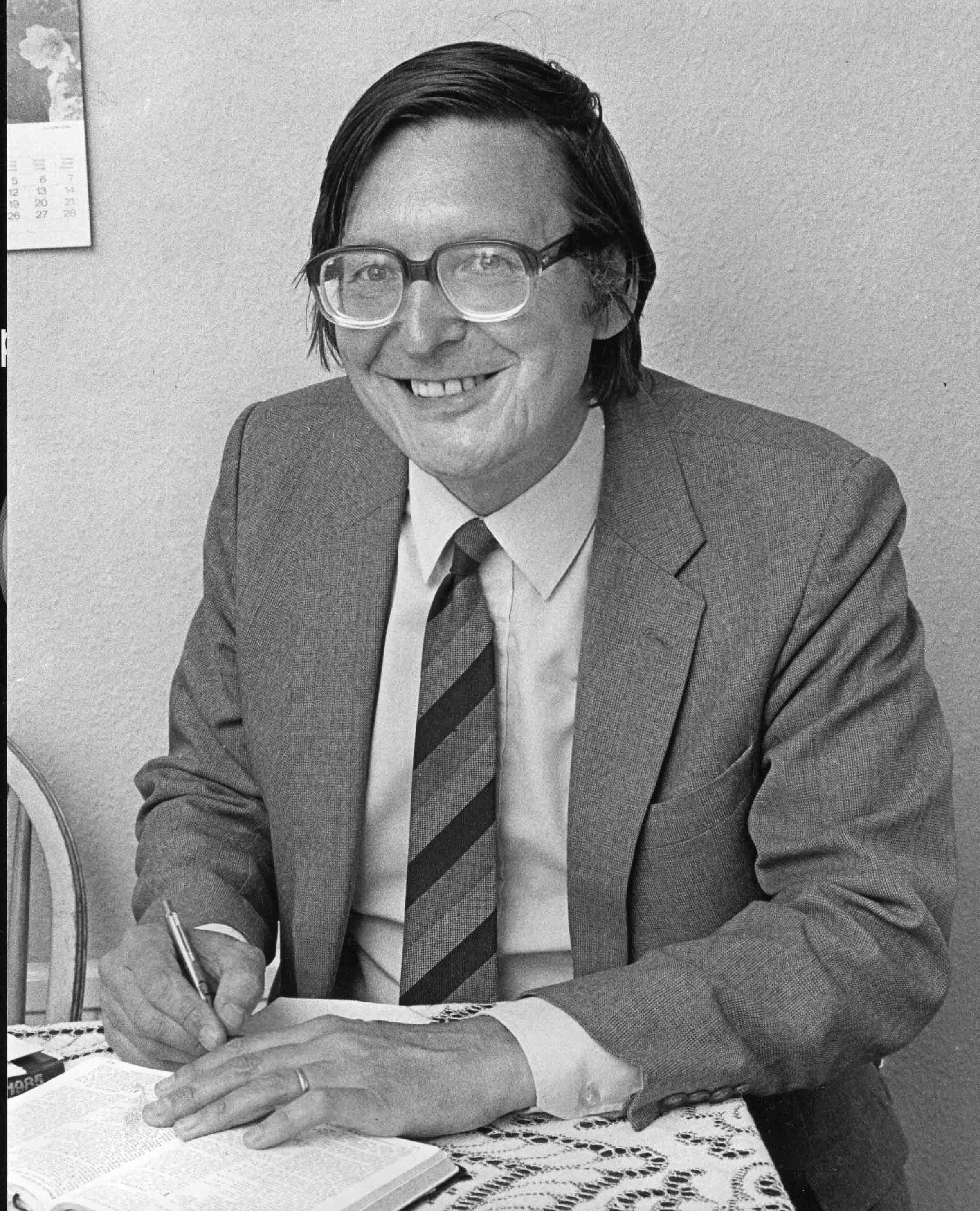 Rev. Rodney Firmin, minister 1975 to 1985, photographed at his desk